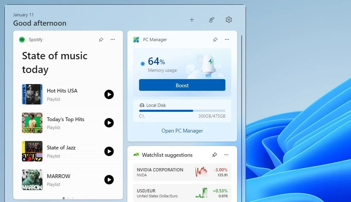 Bảng tiện ích Windows 11 hiển thị widget Spotify với các tùy chọn phát nhạc