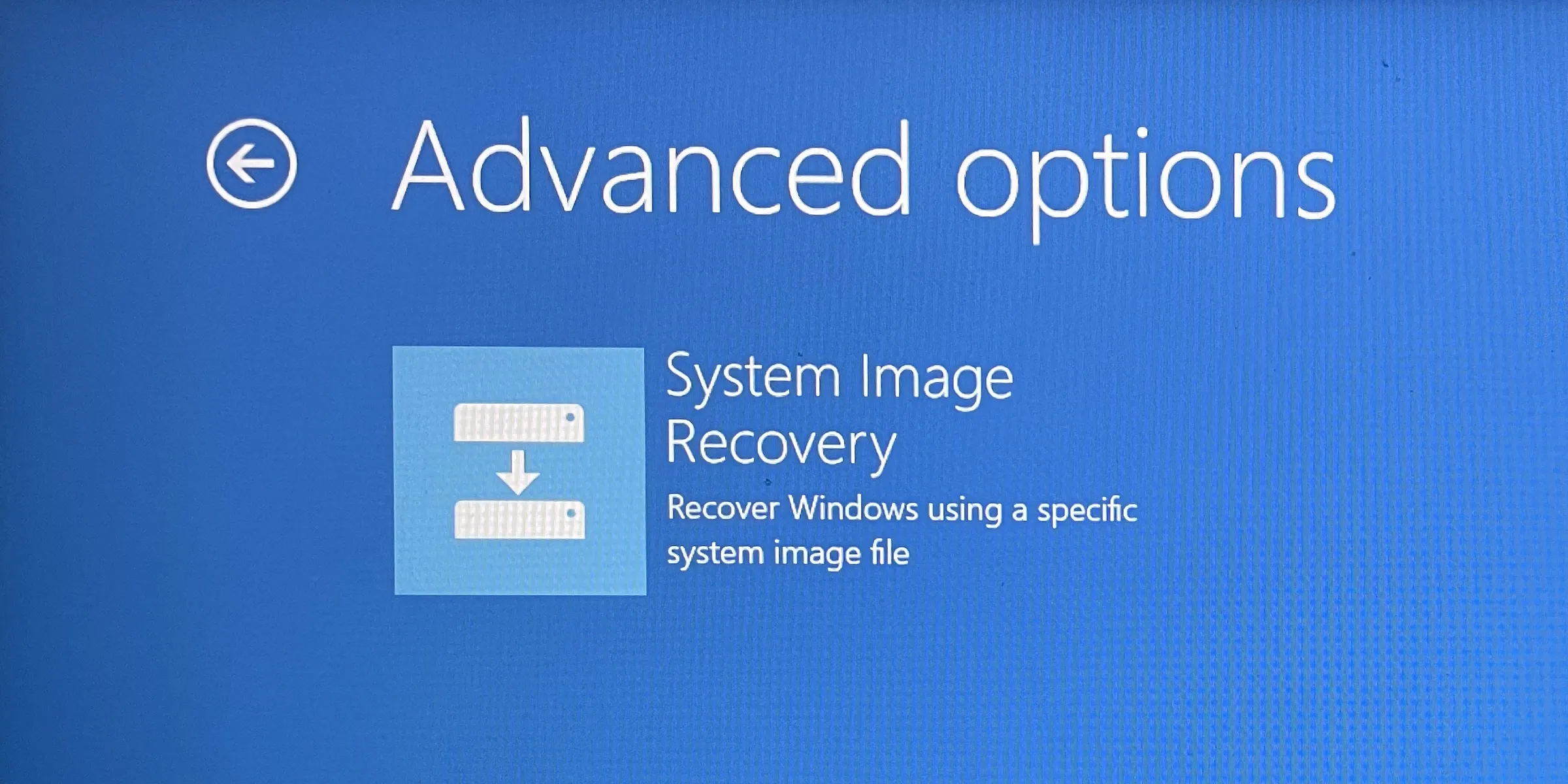 Màn hình More Recovery Options trong Windows Recovery Environment (WinRE) hiển thị tùy chọn System Image Recovery để khôi phục máy tính từ bản sao lưu hệ thống.