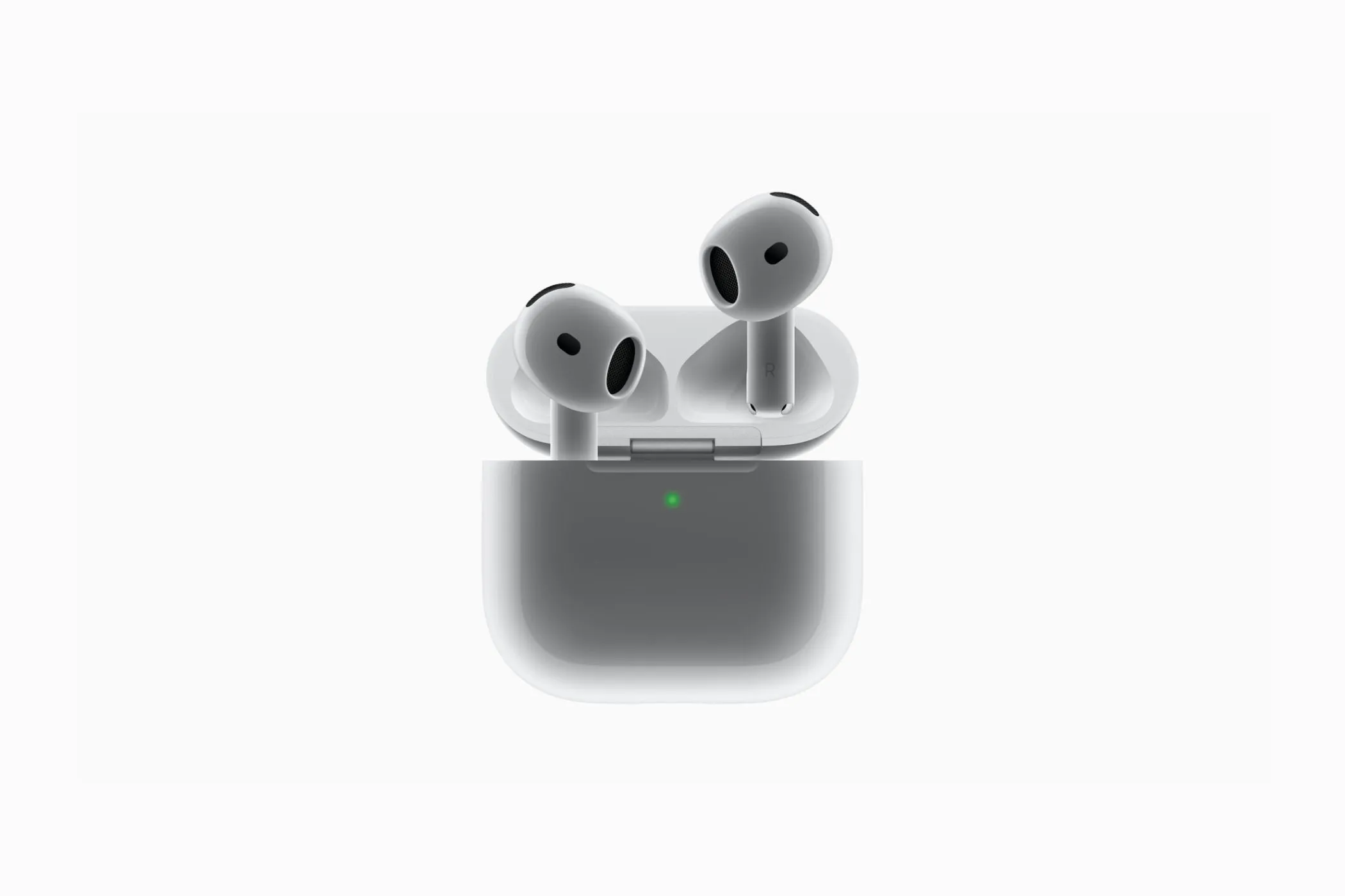 Tai nghe Apple AirPods 4 và hộp sạc đi kèm, cho thấy thiết kế nhỏ gọn hơn và không có nút ghép nối